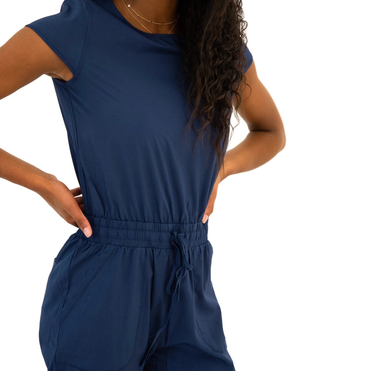 Lavender Danae DT Unity navy jumpsuit for women, featuring a stylish and comfortable one-piece clothing design.
