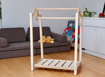 Wooden kids clothing rack from Red Oceanus featuring a sturdy design and natural wood finish, ideal for children&