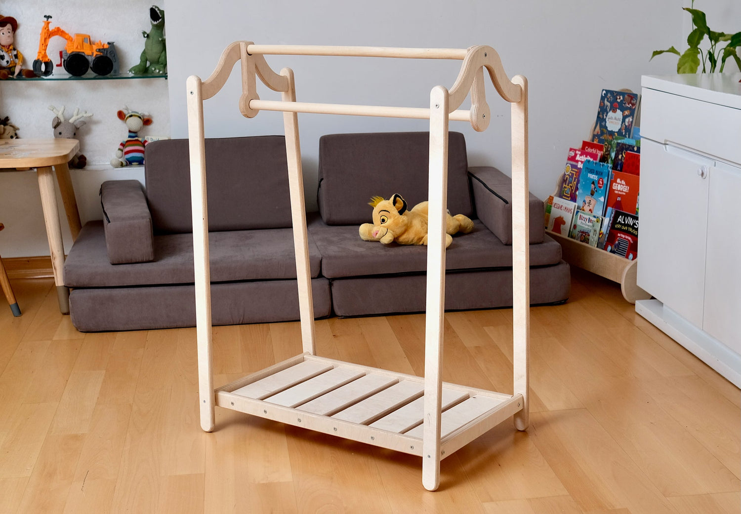 Wooden kids clothing rack from Red Oceanus featuring a sturdy, natural wood finish and space for hanging children&