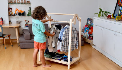 Wooden kids clothing rack by Red Oceanus, featuring a sturdy furniture piece with hooks and shelves for children&