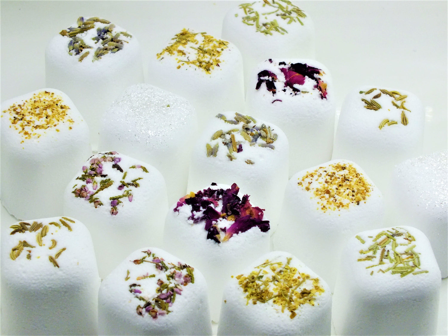 Silver Polyxena Poppy Seed bath bullets with natural ingredients, shown in a clear container for diffuser, oil, and candle collection.