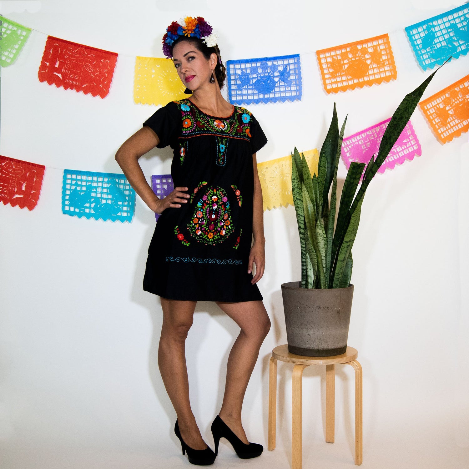 Violet Athena black Mexican dress for women with multicolored floral embroidery and traditional design details.