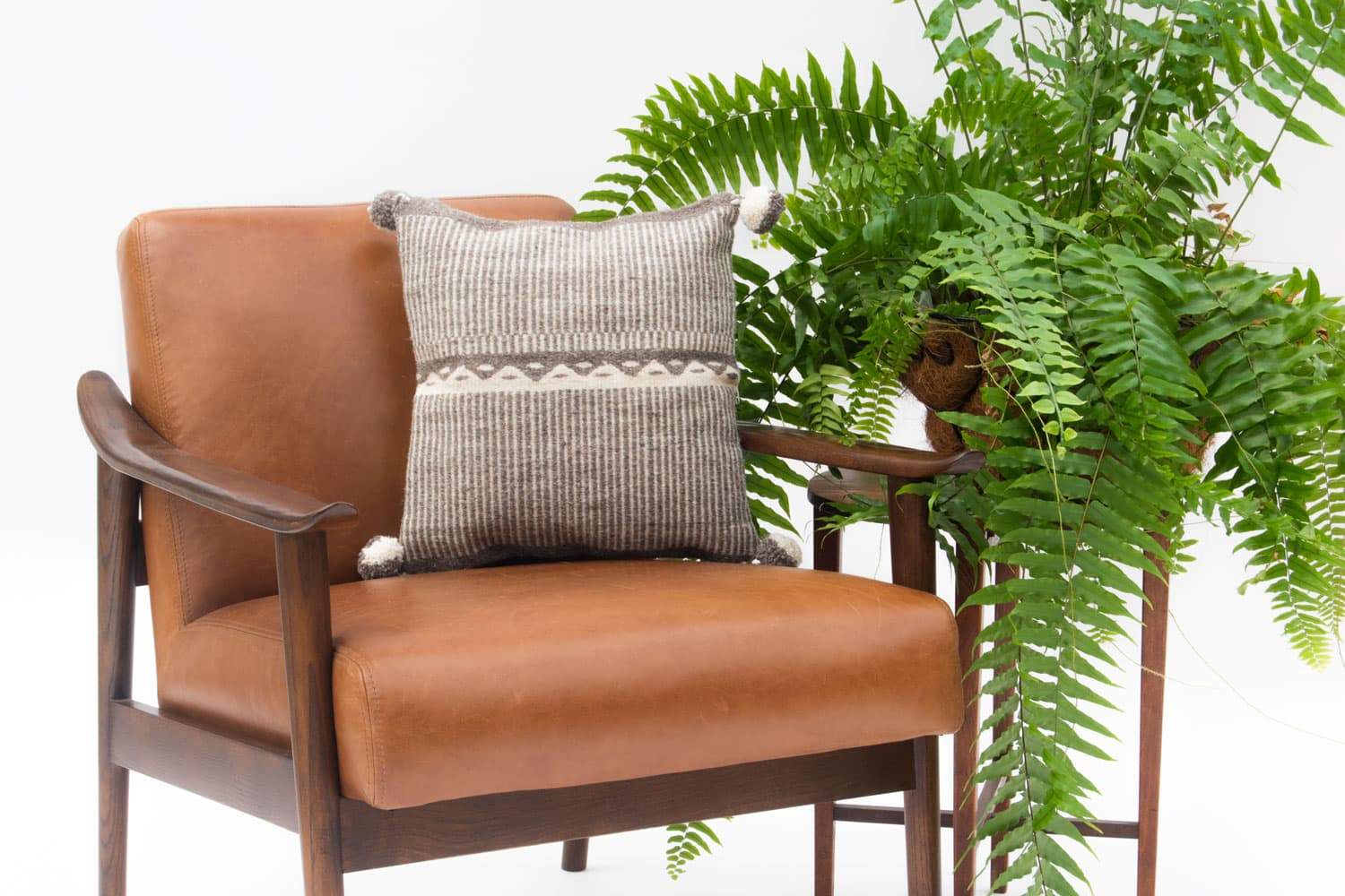 Beige wool pillow cover featuring mountain design, from Violet Athena, suitable for home decor and cozy living spaces.