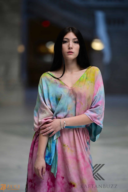 Light and soft watercolor kaftan dress by Erin Pontus with fairytale-inspired colors and flowing, elegant fabric.