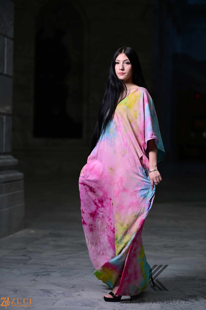 Dreamy watercolor kaftan dress by Erin Pontus featuring light, soft fabrics and fairytale-inspired colors, perfect for elegant summer wear.