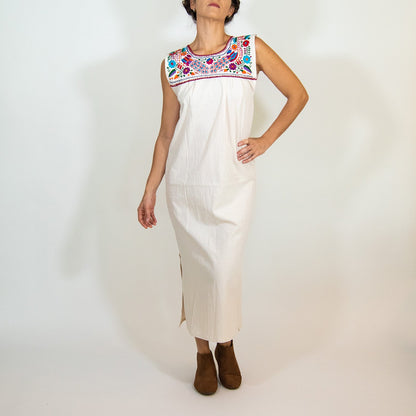 White Maxi Isidra Mexican embroidered dress for women by Violet Athena, featuring intricate embroidery and flowing fabric.