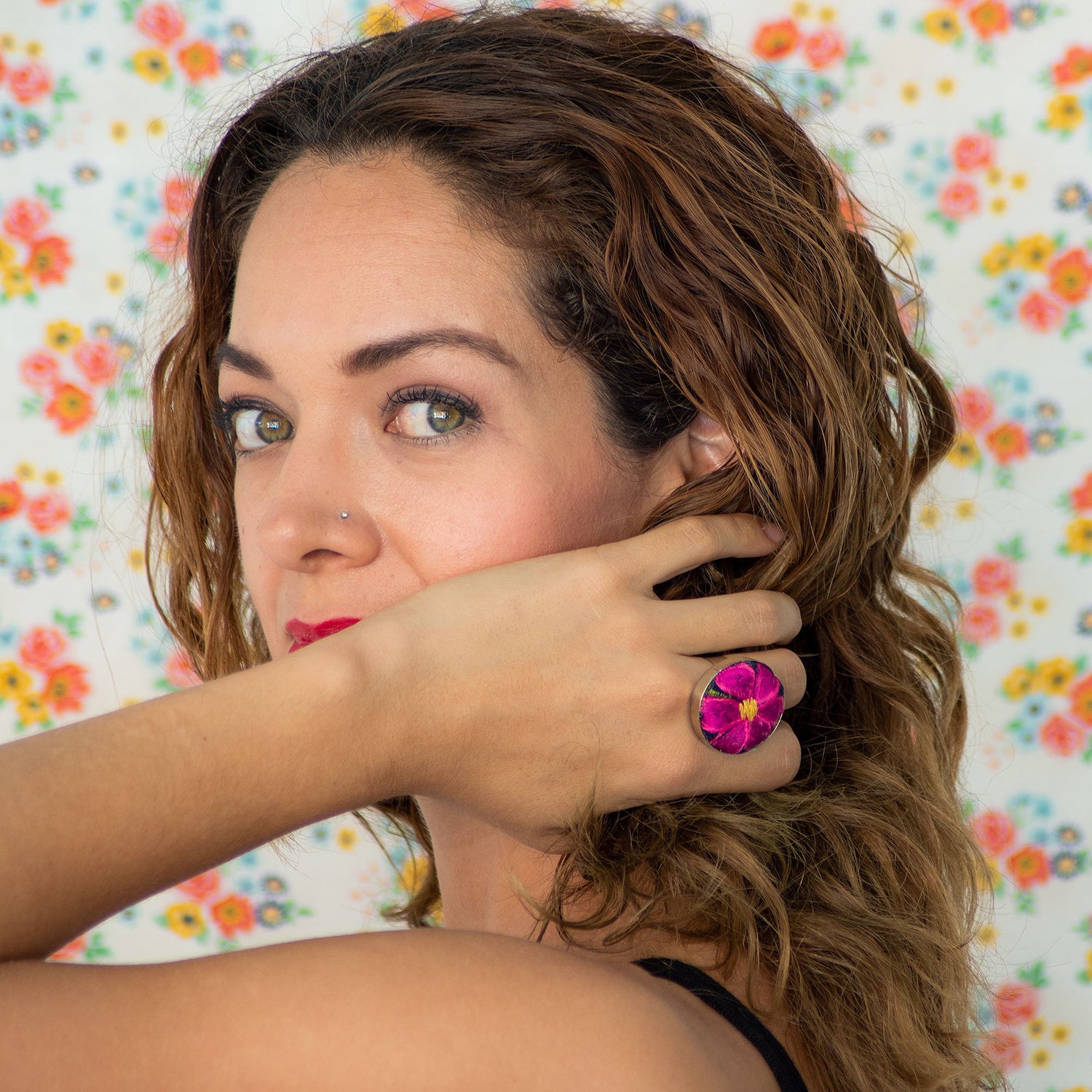 Violet Athena textile flower Mexican ring worn on a woman&