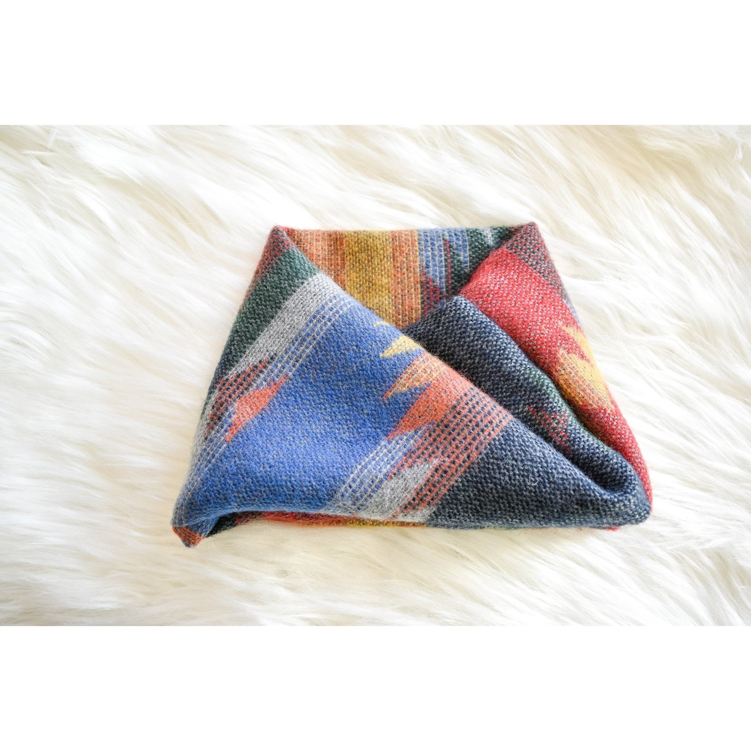 Scarlet Gaia Sequoia dog scarf with green and brown leaf pattern, cozy pet accessory for stylish dogs.