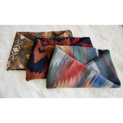 Scarlet Gaia Sequoia dog scarf featuring a stylish, patterned fabric designed for pets, shown on a small to medium dog.