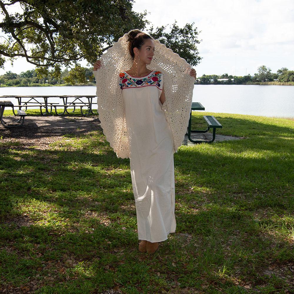 White Maxi Isidra Mexican embroidered dress for women by Violet Athena, featuring intricate embroidery and flowing fabric.