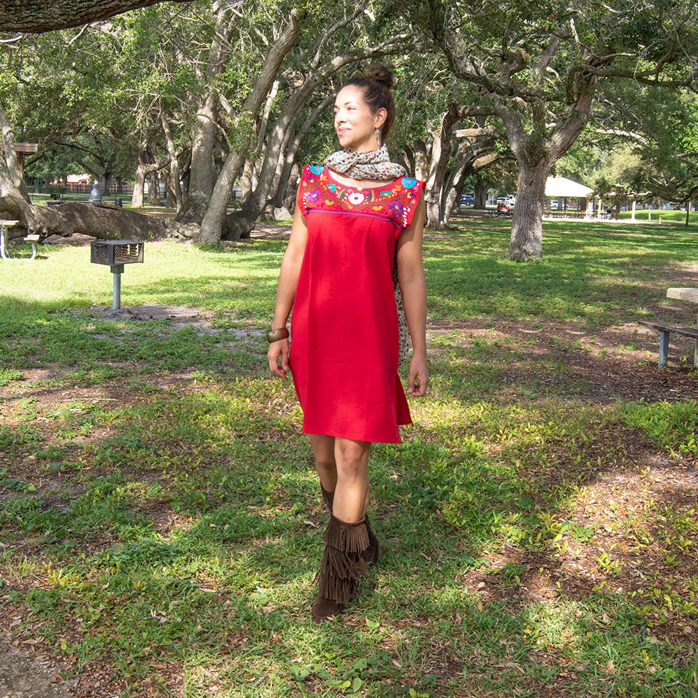 Handmade folk dress for women by Violet Athena featuring intricate patterns and vibrant colors, showcased on a mannequin.