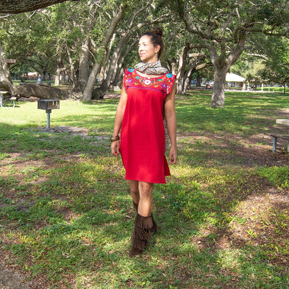 Handmade folk dress for women by Violet Athena featuring intricate patterns and vibrant colors, showcased on a mannequin.