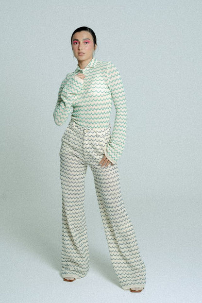 Green lightweight long sleeve button-up cotton knit shirt for women by Raspberry Molly, shown on a model.