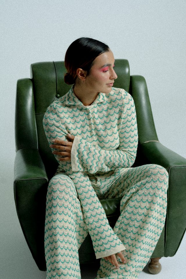 Lightweight green long sleeve button-up cotton knit shirt for women by Raspberry Molly, showing the fitted collar and smooth fabric.