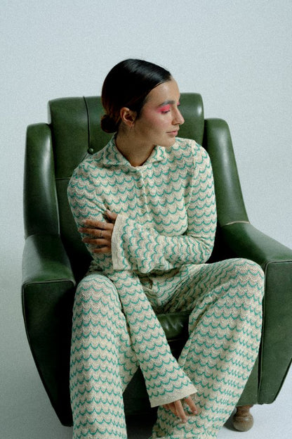 Lightweight green long sleeve button-up cotton knit shirt for women by Raspberry Molly, showing the fitted collar and smooth fabric.