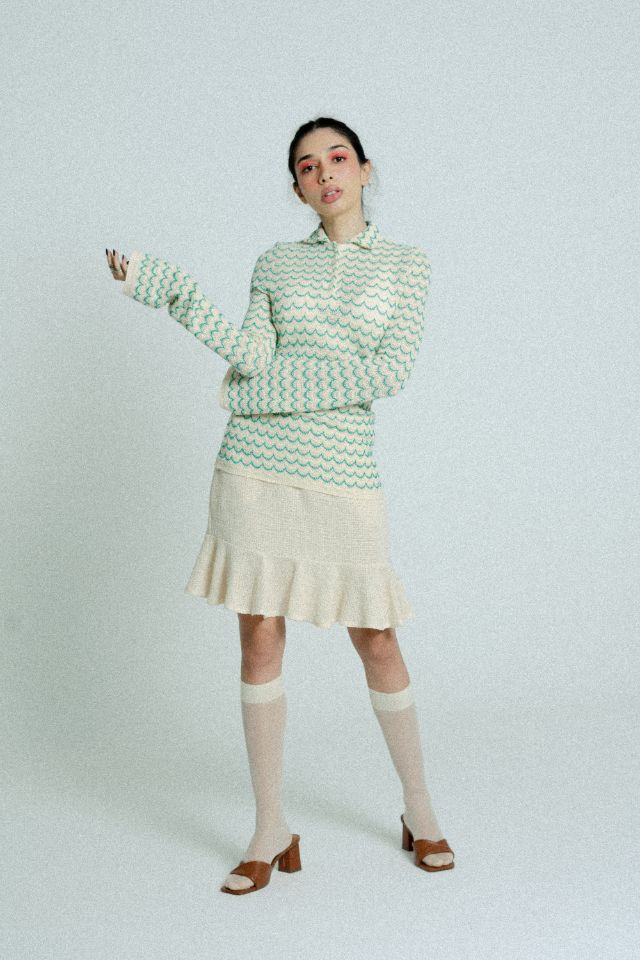 Green lightweight long sleeve cotton knit button-up shirt for women by Raspberry Molly, shown on a hanger.