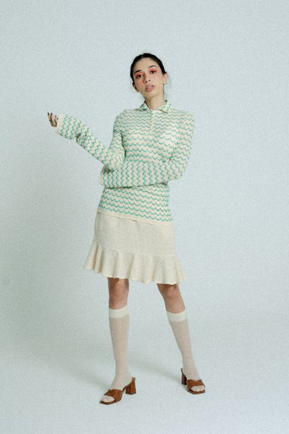 Green lightweight long sleeve cotton knit button-up shirt for women by Raspberry Molly, shown on a hanger.