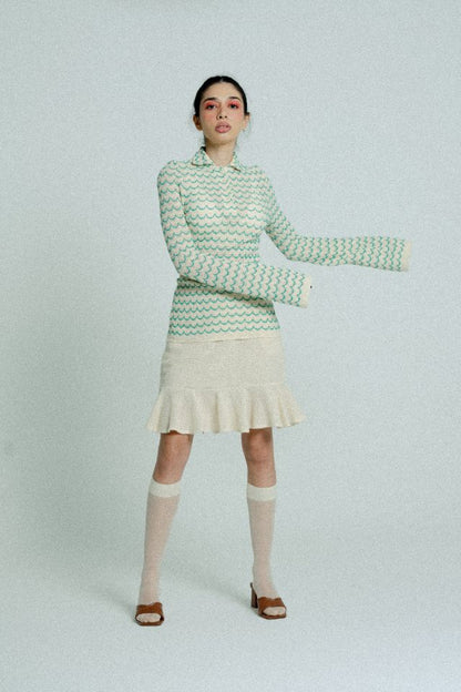 Green lightweight long sleeve cotton knit button-up shirt for women by Raspberry Molly, shown on a model.