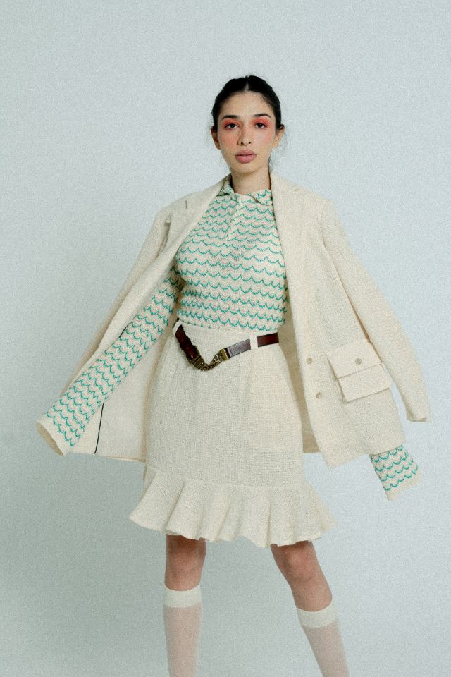 Lightweight green long sleeve cotton knit button-up shirt for women by Raspberry Molly, shown on a hanger.