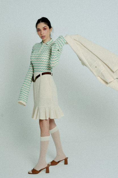 Green lightweight long sleeve button-up cotton knit shirt for women by Raspberry Molly, shown on a model.
