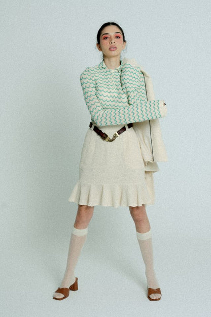 Green lightweight long sleeve cotton knit button-up shirt for women by Raspberry Molly, shown on a model.