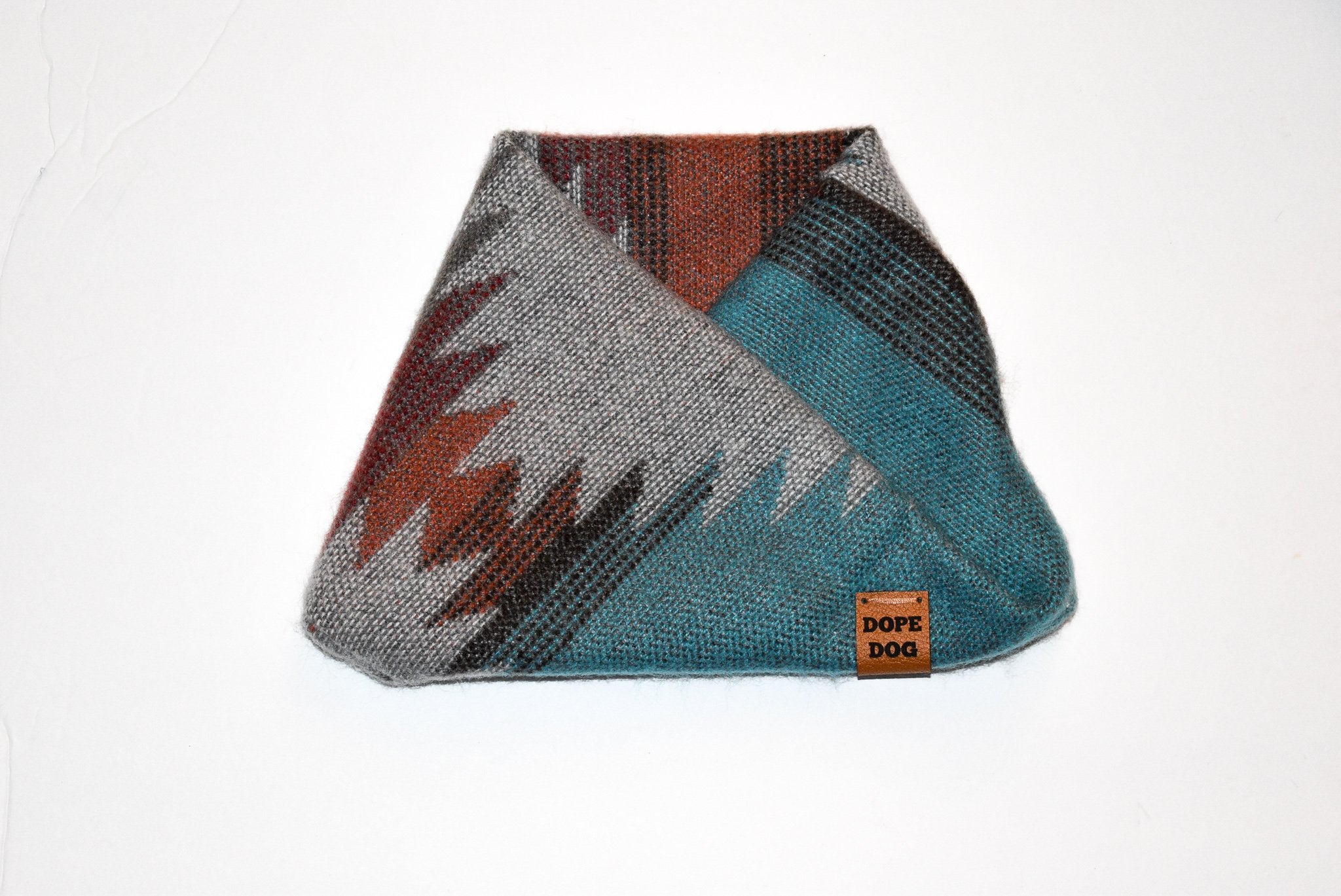Scarlet Gaia Yosemite Dog Scarf on a playful brown dog, showcasing stylish pet accessories.