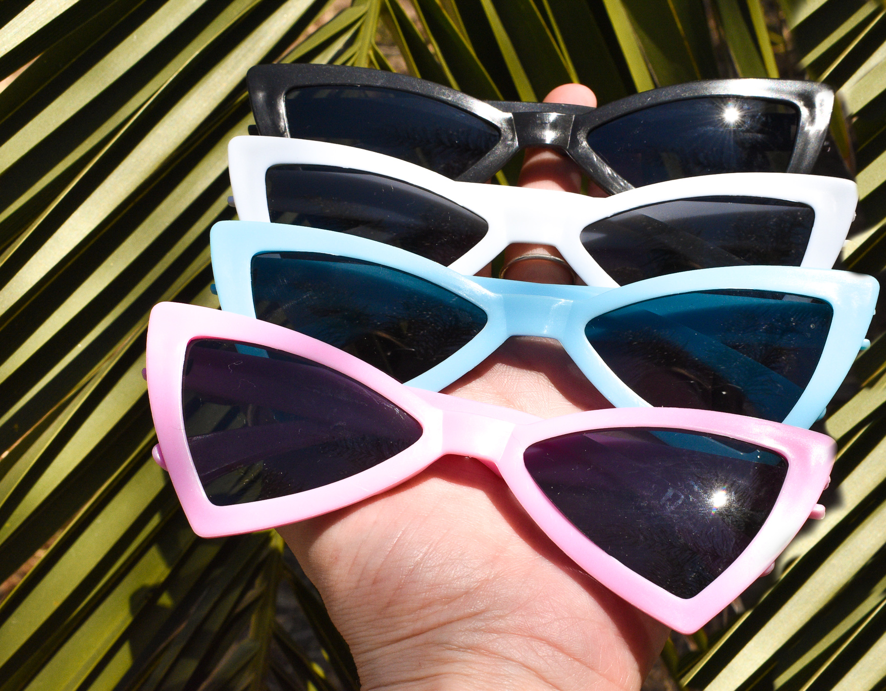 Scarlet Gaia dog sunglasses with black frames and tinted lenses, designed for pets to protect their eyes from sun.