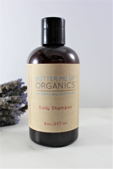 White Smokey Organic Daily Shampoo bottle, natural hair care product with a clean, minimalist design and white and green packaging.