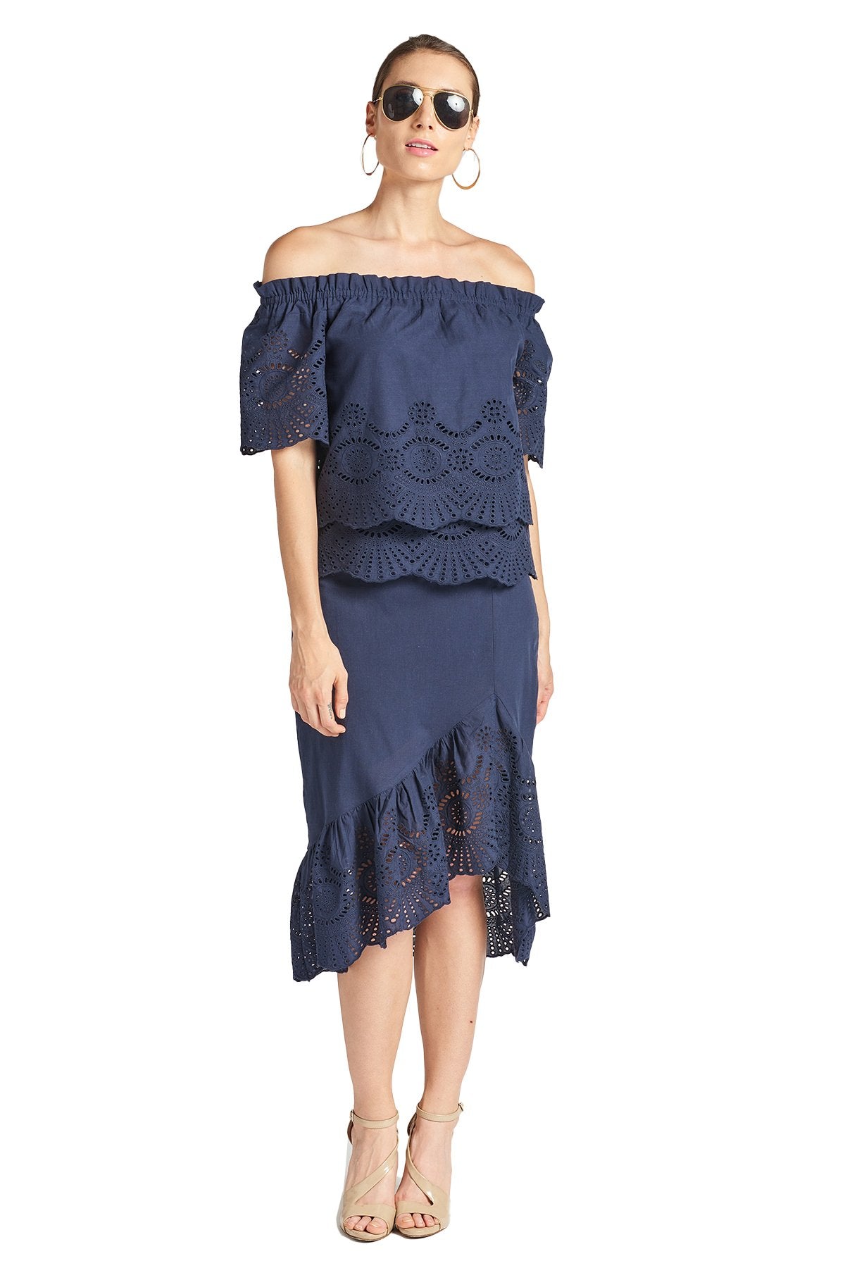 Navy Aster Skirt by Peach Dionysus, cotton eyelet asymmetric hi-lo design, shown in front view with a casual lifestyle setting