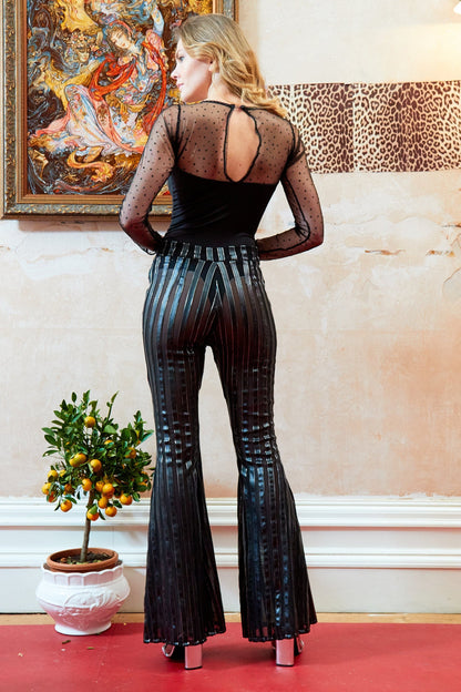 Long-sleeve mesh bodysuit from Blush Athena paired with Sly trousers, featuring sheer fabric and fitted style.
