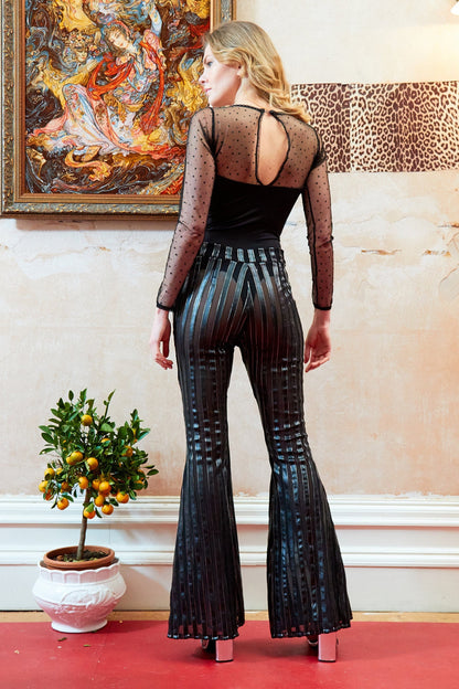 Long-sleeve mesh bodysuit by Blush Athena paired with Sly trousers, featuring a fitted design and see-through fabric.