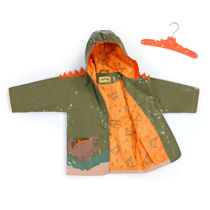 Kids dinosaur raincoat by Magenta Ash hanging open, showing colorful cartoon dinosaur design on waterproof fabric.
