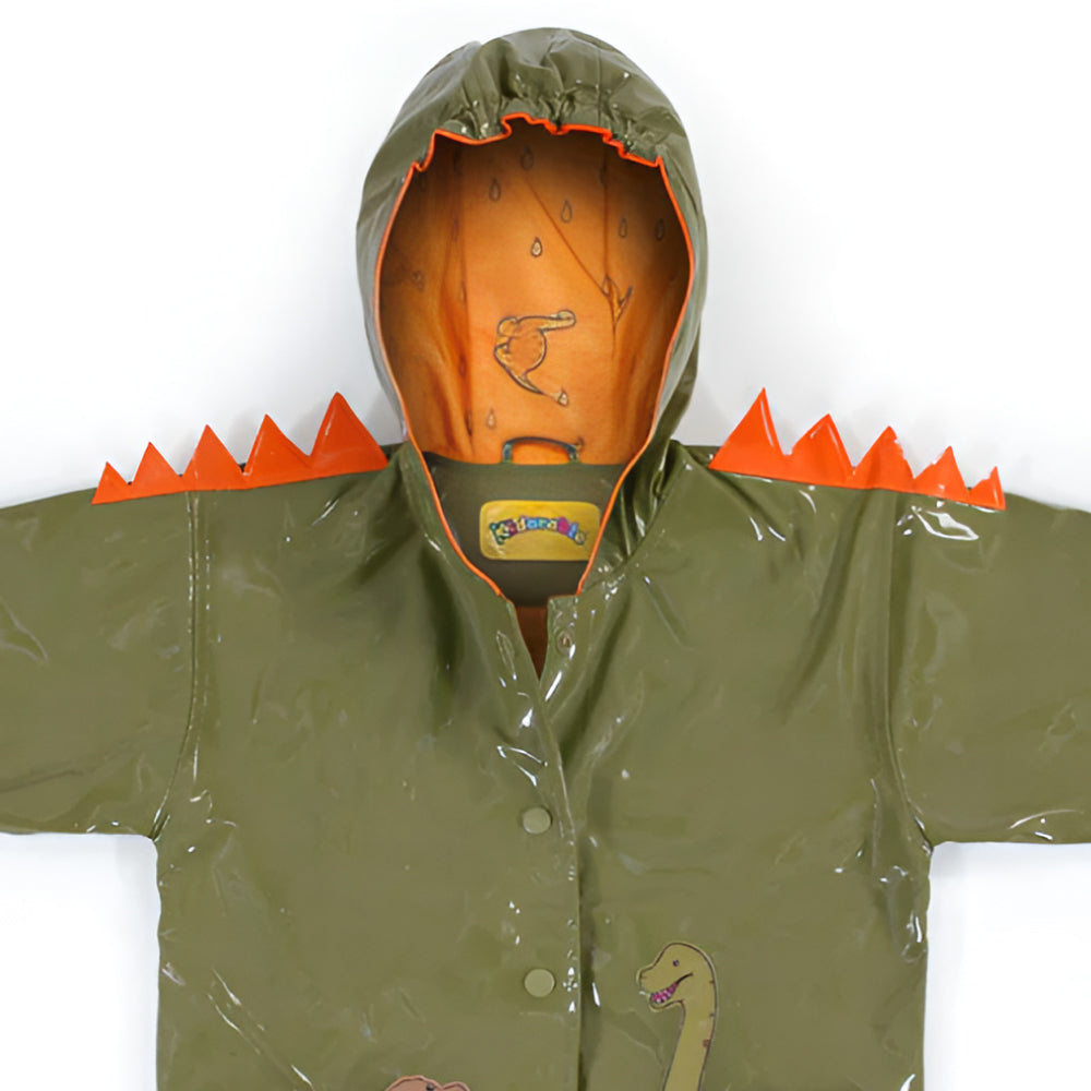 Kids Dinosaur Raincoat by Magenta Ash with a playful dinosaur design, shown hanging on a white background.