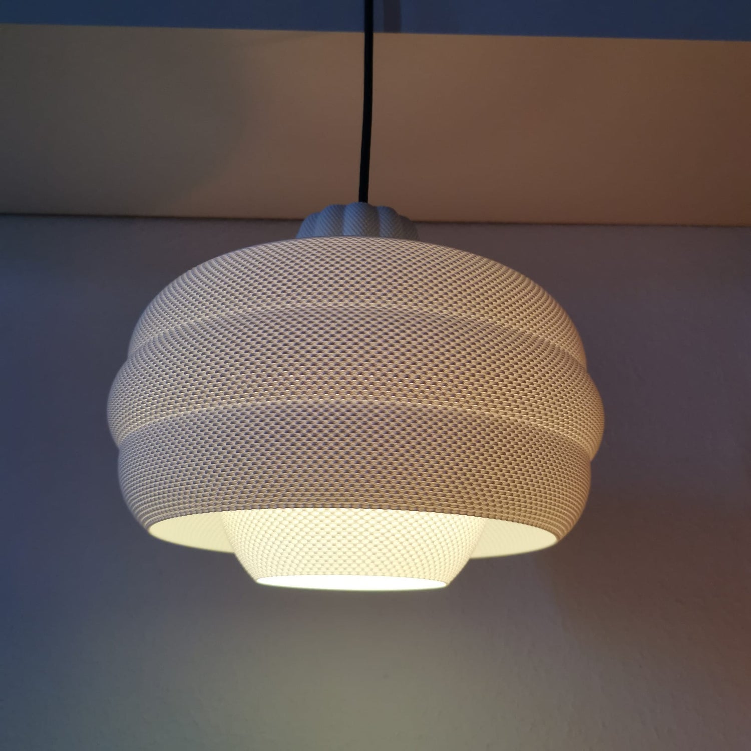 Azure Pontus Dynasty Glow pendant lamp hanging with warm light, modern lighting fixture with sleek design and stylish details.