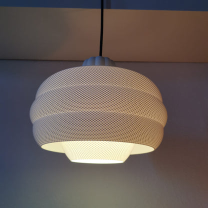 Azure Pontus Dynasty Glow pendant lamp hanging with warm light, modern lighting fixture with sleek design and stylish details.