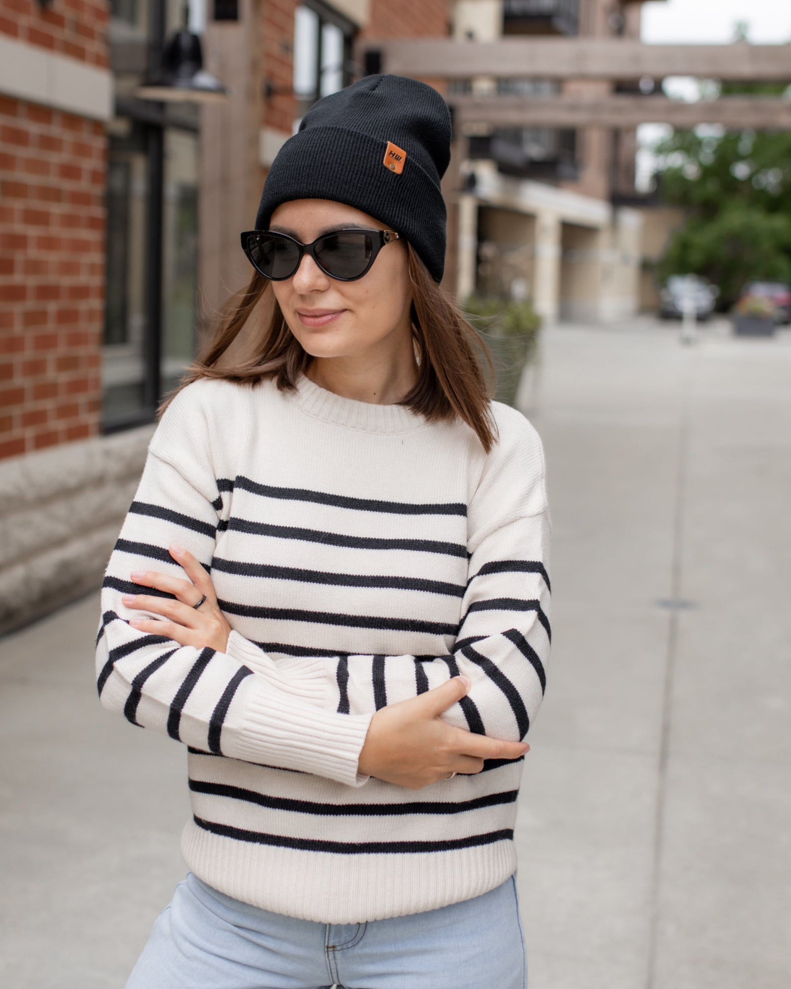 Azure Arrowwood HAAKWEAR Knit Cuffed Beanie in Dune Beige, showcasing a cozy, ribbed knit hat with a cuffed brim.