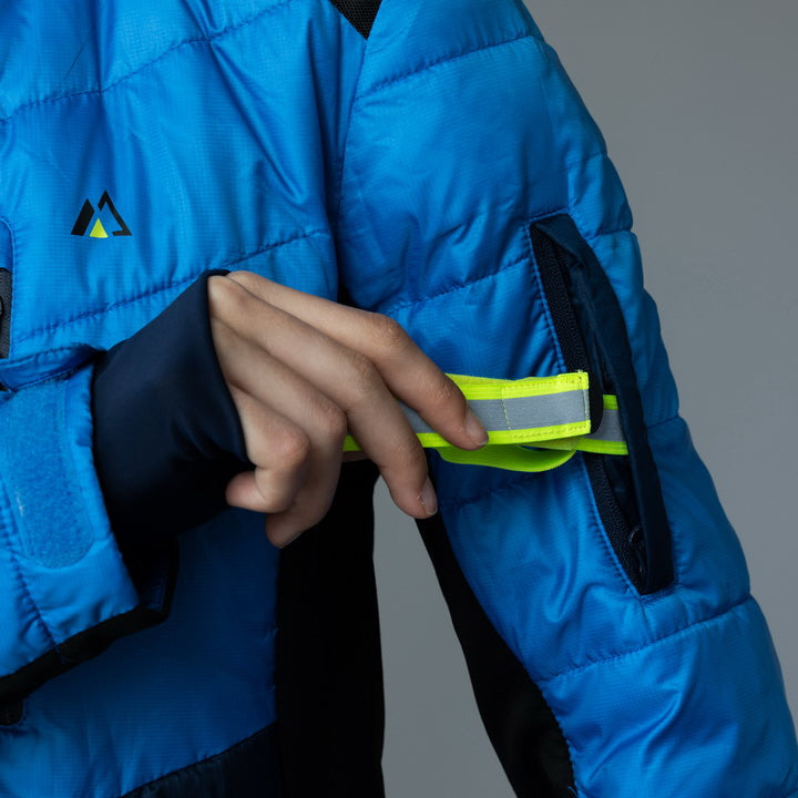 Women’s blue EcoDown jacket by Rose Hemera, lightweight activewear with a quilted design and hood, suitable for outdoor activities.
