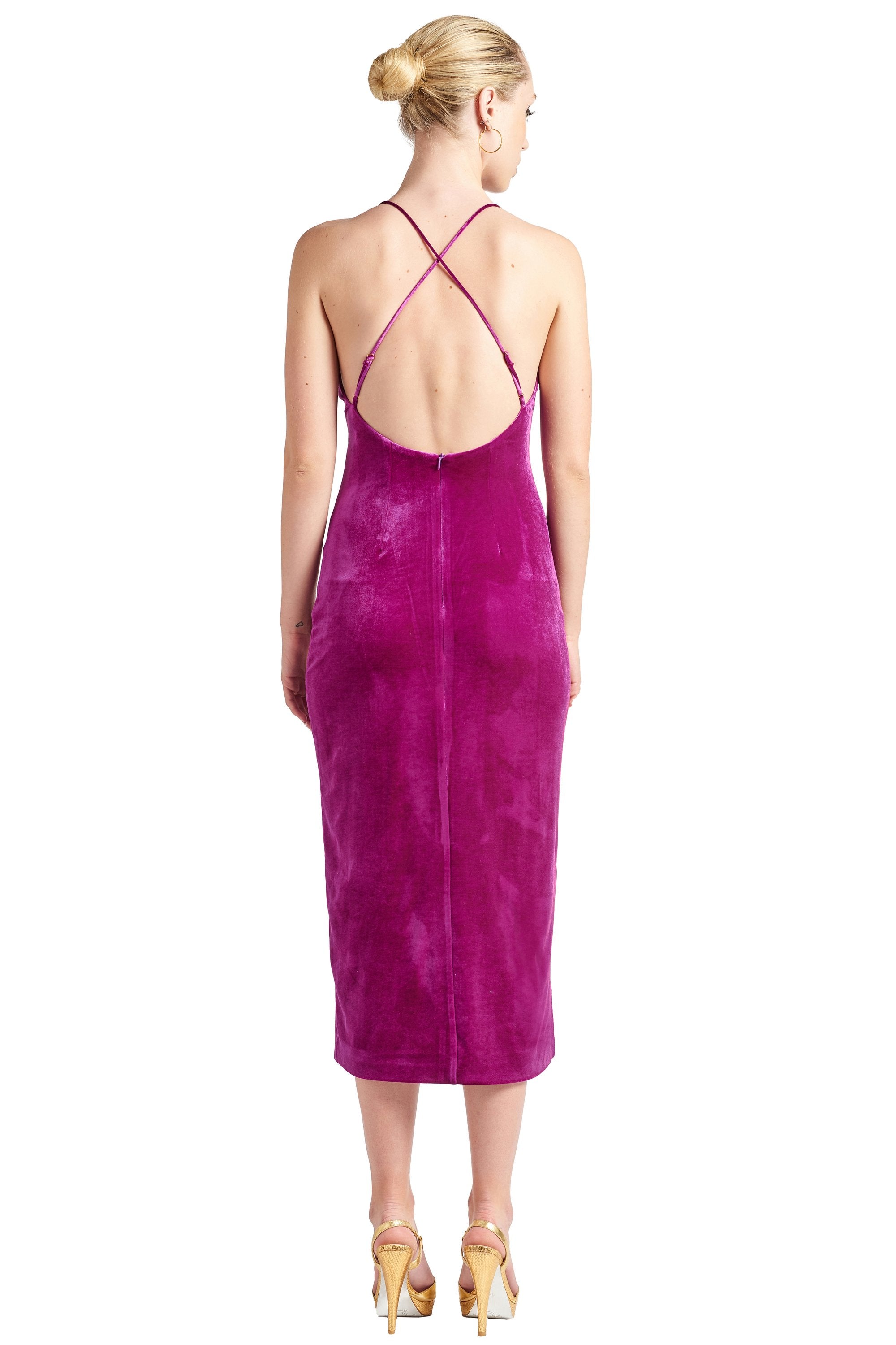 Peach Dionysus Elle Magenta Velvet Long Slip Dress with front thigh slit and low criss, shown from the back view.