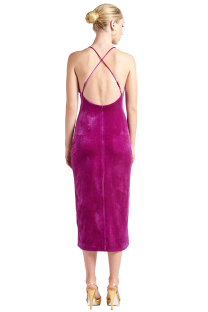 Peach Dionysus Elle Magenta Velvet Long Slip Dress with front thigh slit and low criss, shown from the back view.