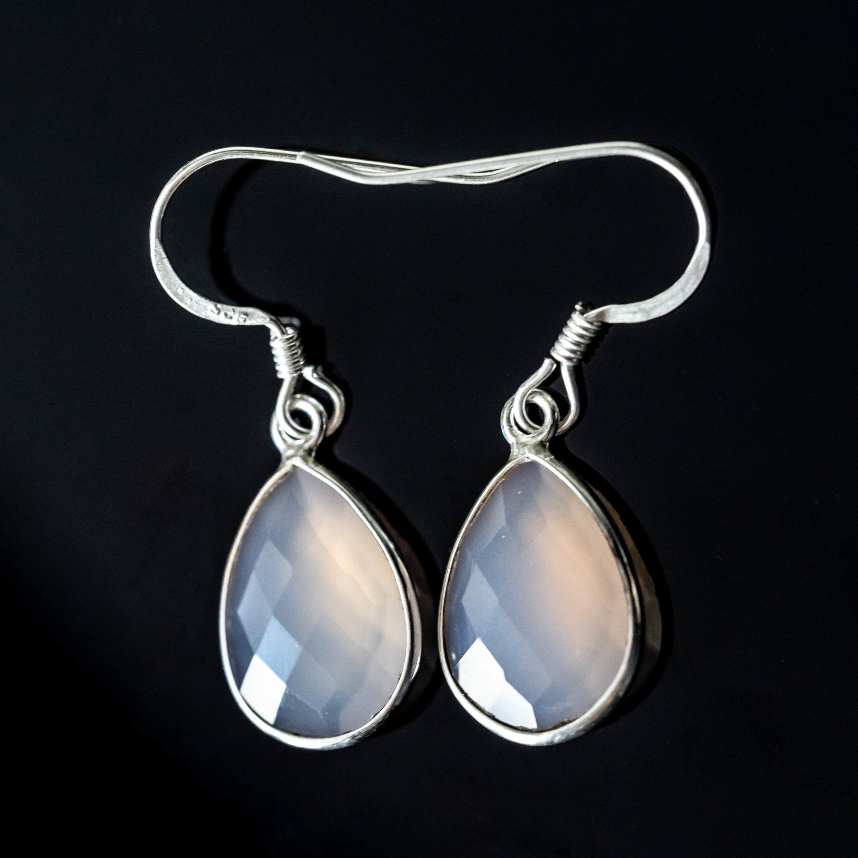 Sapphire Maple Emilia Chalcedony tear-drop earrings with silver hooks, featuring smooth, polished blue chalcedony stones.