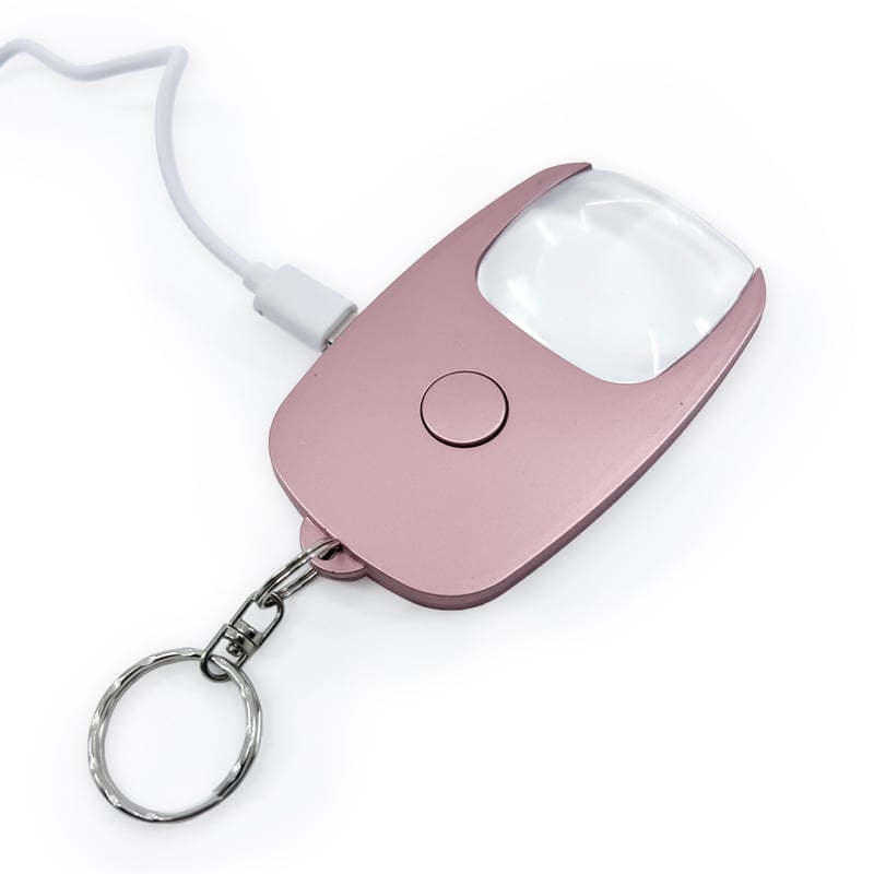 Byzantium Eleusis Pocket Zoom™ Recharge mini magnifier with LED light showing a compact, portable handheld device with built-in illumination.