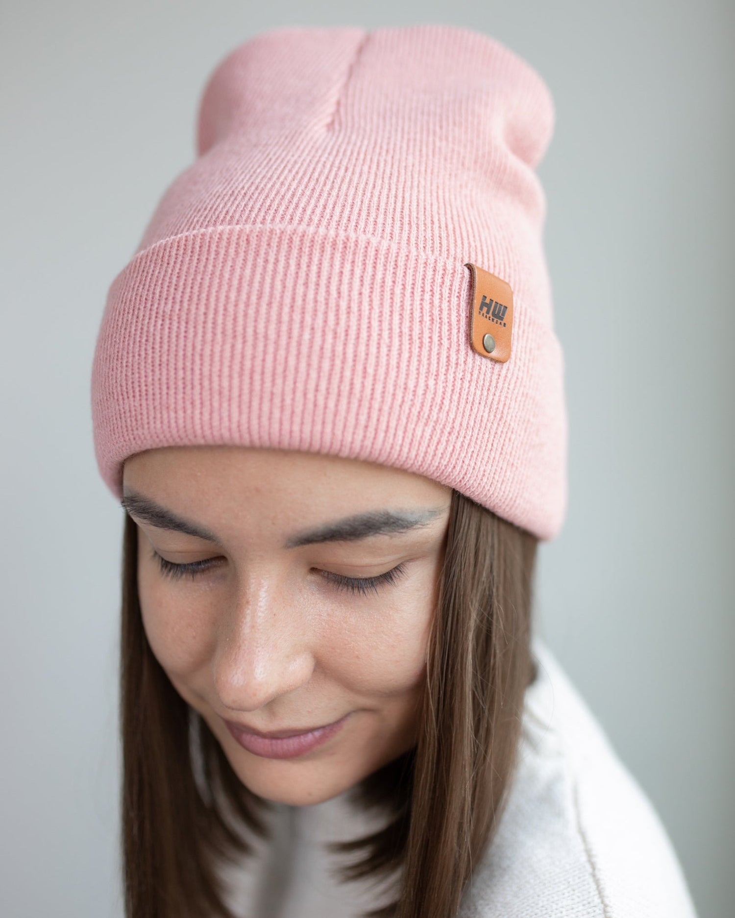 Azure Arrowwood HAAKWEAR Knit Cuffed Beanie in Pearl Pink, cozy winter hat with a ribbed cuff and soft knit texture.