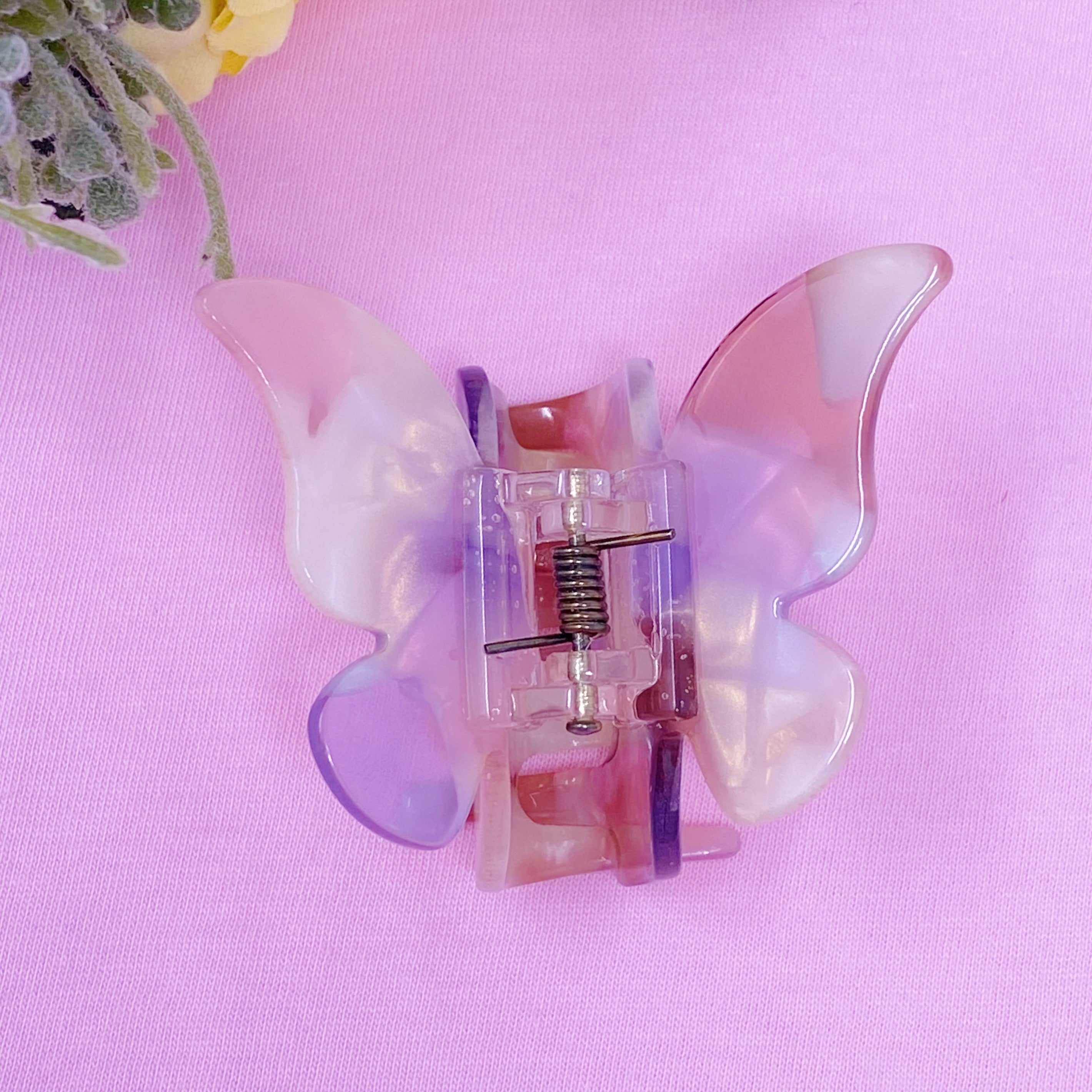 Fuchsia Hercules butterfly-shaped hair claw jewelry accessory with elegant design and polished finish.
