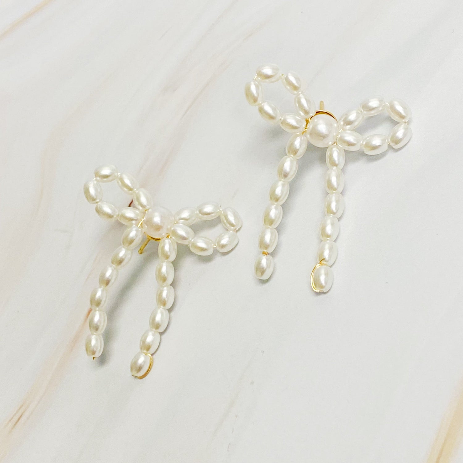 Fuchsia Hercules Pearl Bow Ballerina Earrings with white pearls and delicate bow design, jewelry and watches accessory