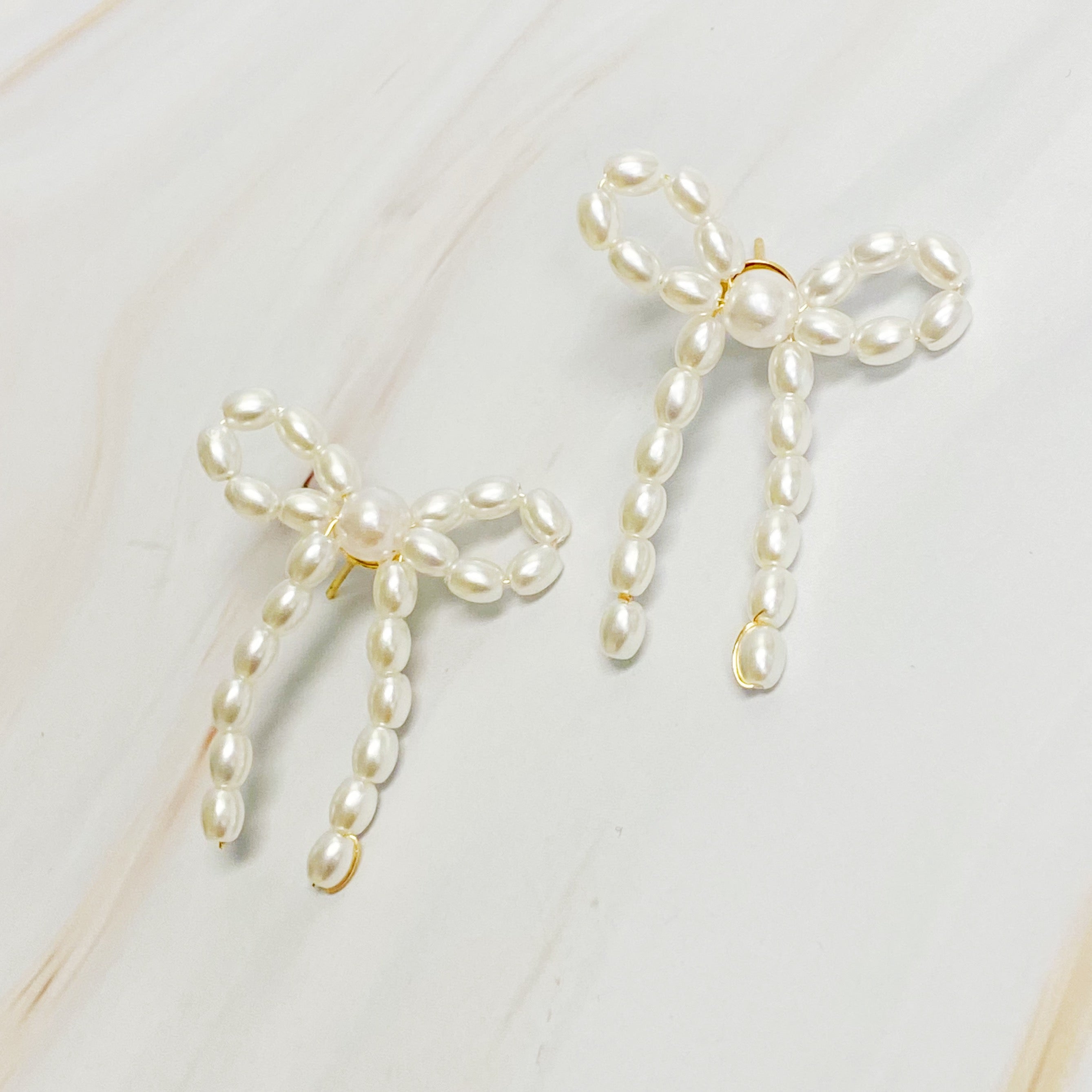 Fuchsia Hercules Pearl Bow Ballerina Earrings with white pearls and delicate bow design, jewelry and watches accessory