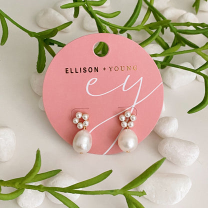 Fuchsia Hercules freshwater pearl drop earrings with elegant jewelry design, showcasing shiny pearl drops hanging from delicate hooks.