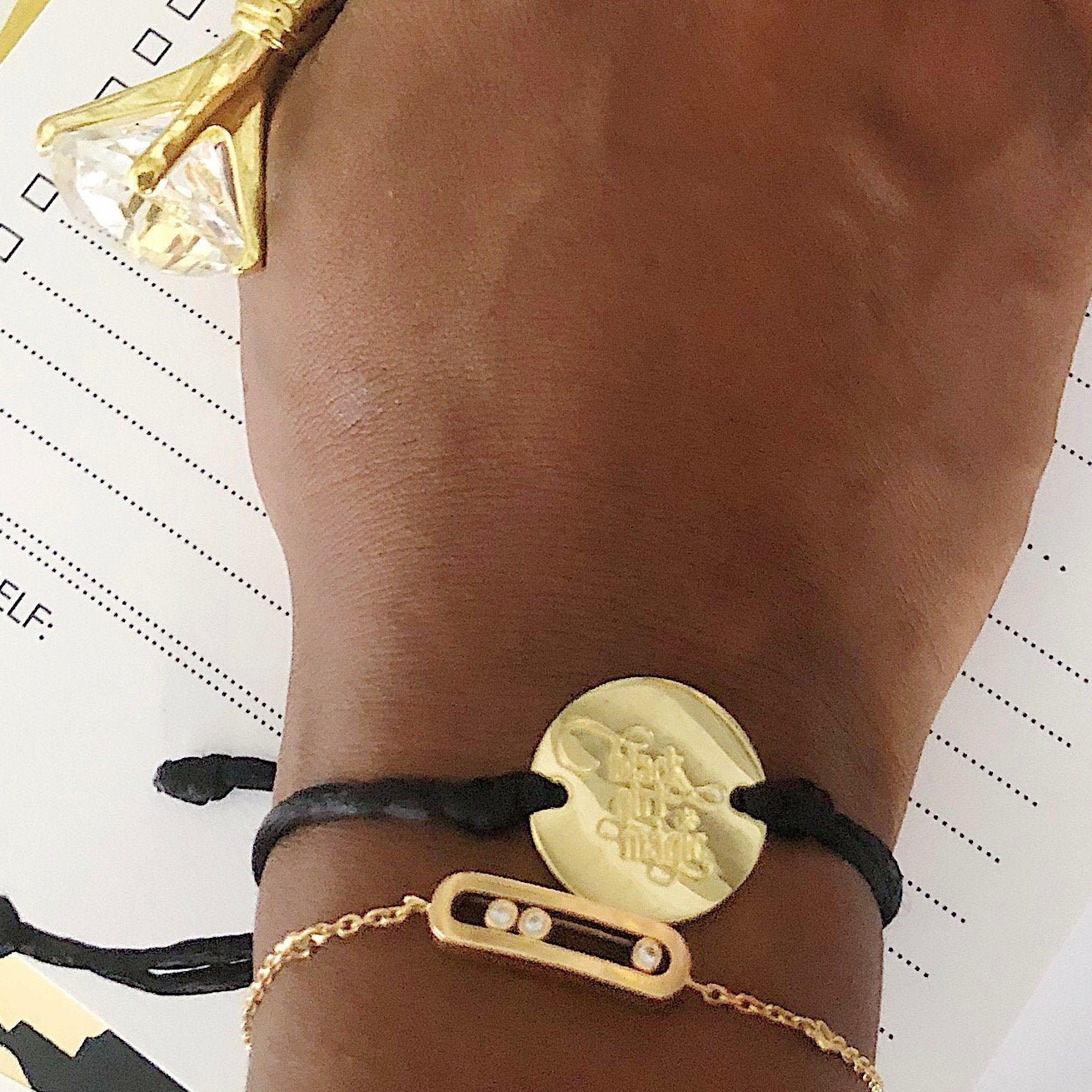 Black Girl Magic bracelet by Sky Blue Iapetus featuring a stylish design, displayed on a neutral background.