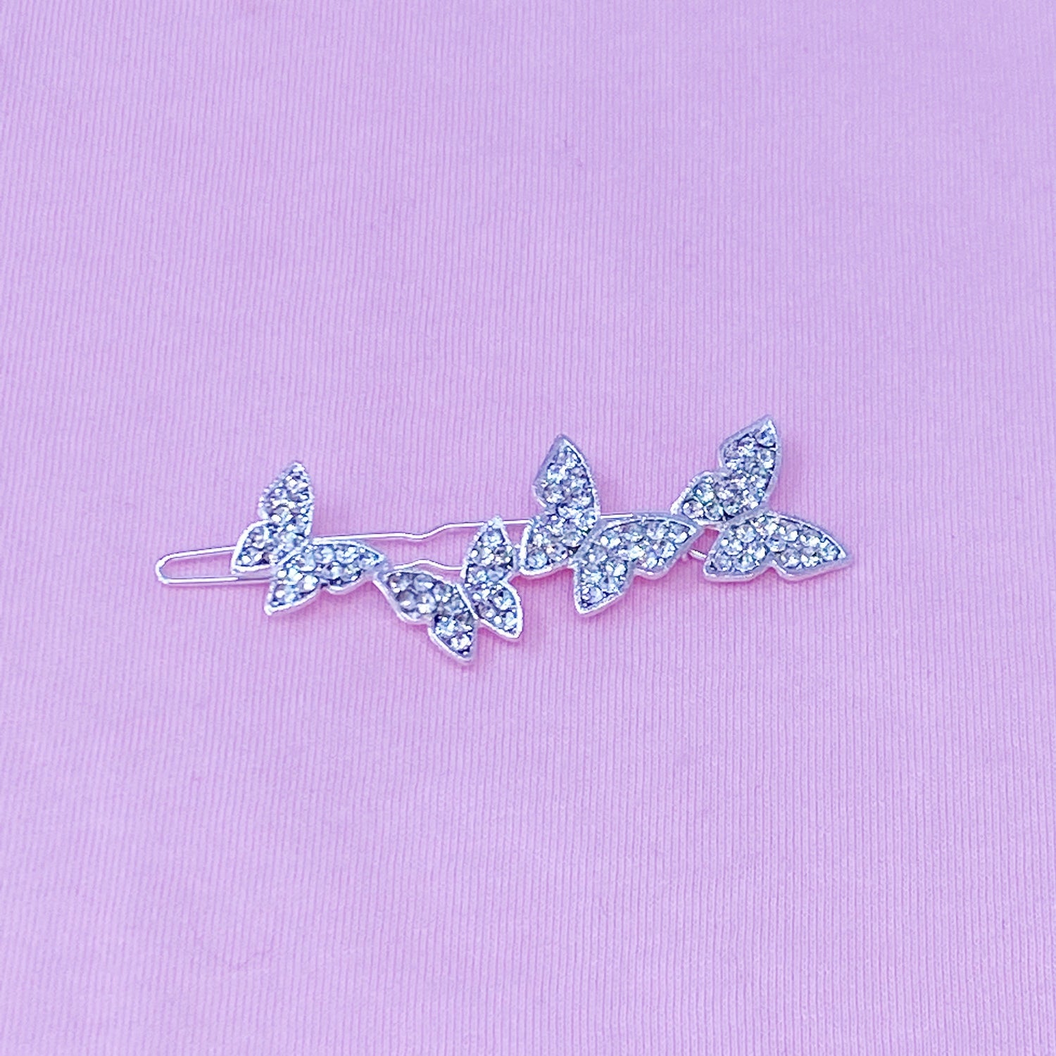 Fuchsia Hercules Fly Away Hair Clip featuring elegant jewelry design, with intricate metalwork and decorative details.