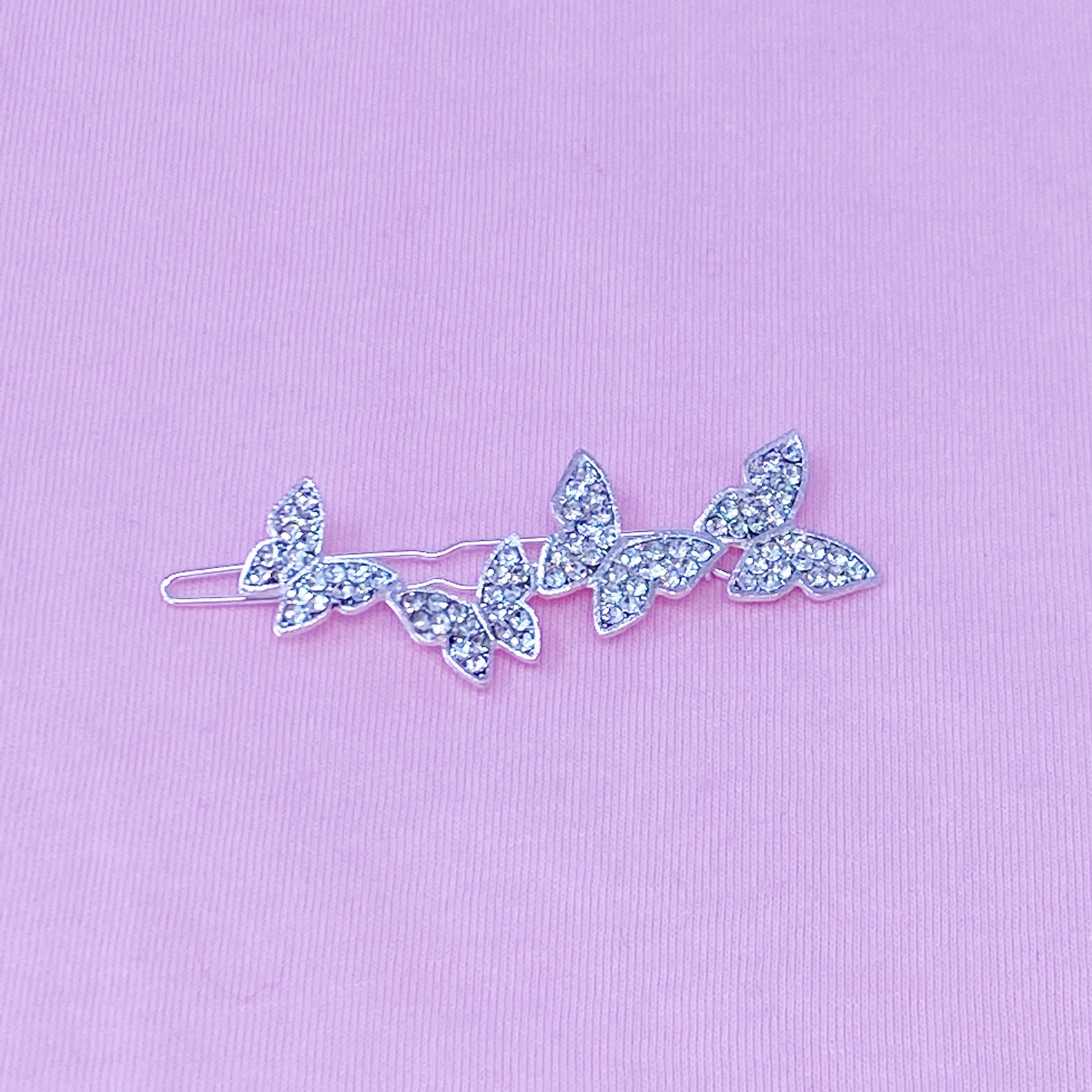 Fuchsia Hercules Fly Away Hair Clip featuring elegant jewelry design, with intricate metalwork and decorative details.