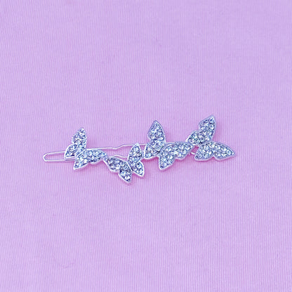 Fuchsia Hercules Fly Away Hair Clip featuring elegant jewelry design, with intricate metalwork and decorative details.